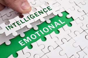 The human hand fills the last missing elements of the surface from the jigsaw puzzle